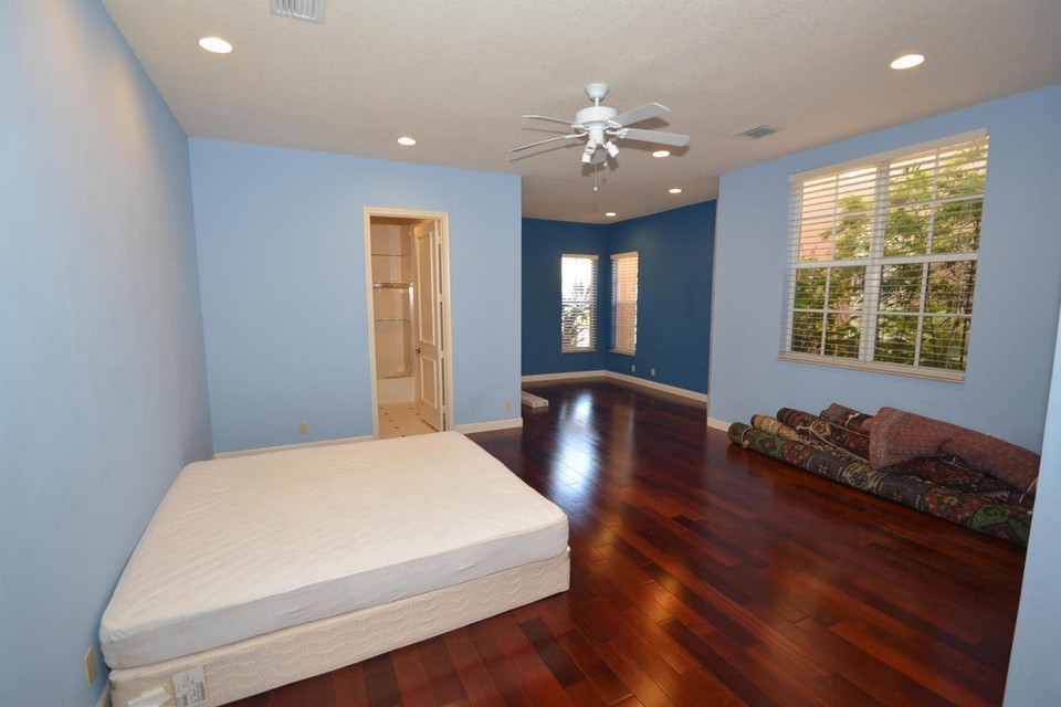 2 rooms converted to one large bedroom with wood floors